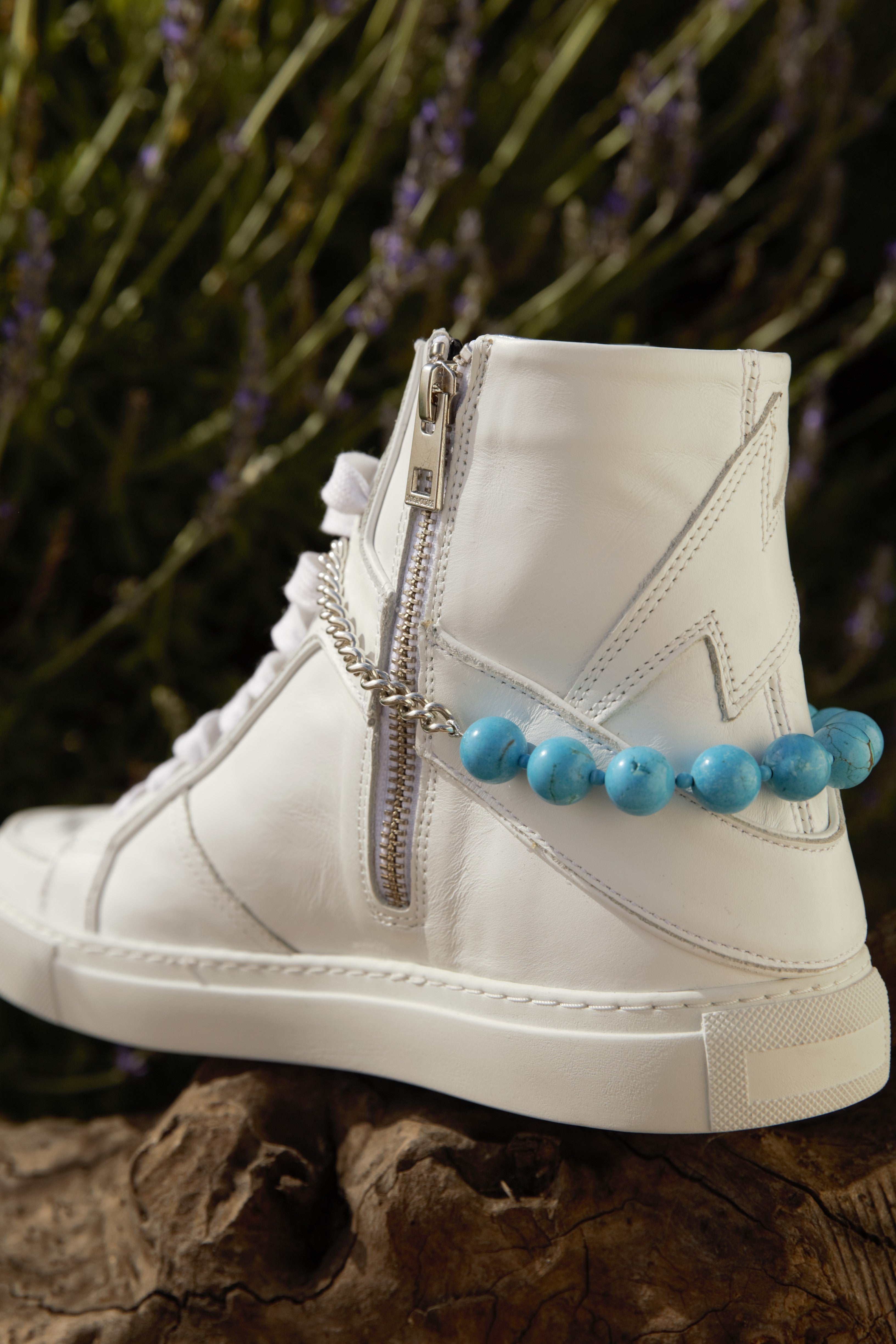 High top with turquoise spur and steel chain