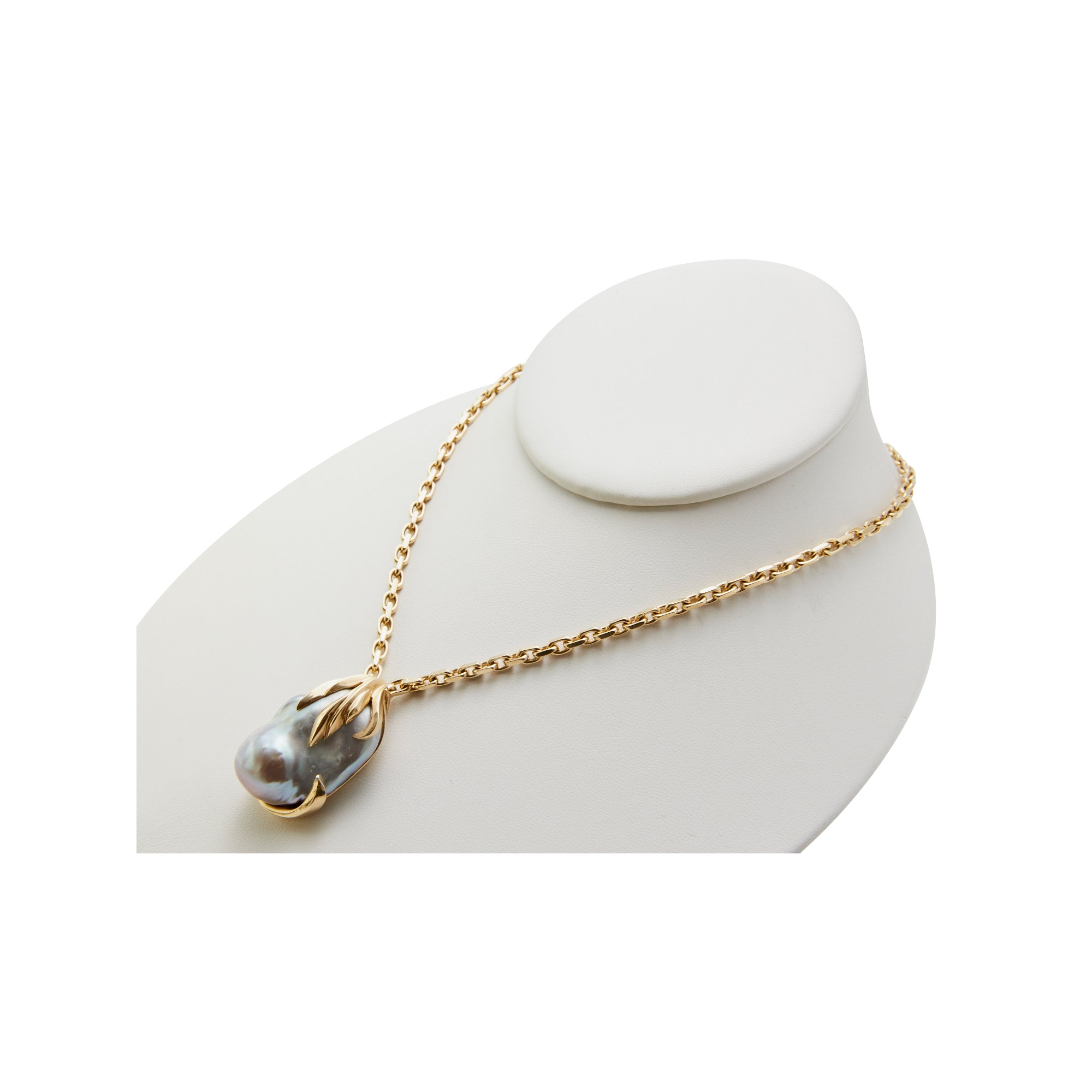 Gold draped baroque pearl from Jeuje Fine Jewelry on a white background