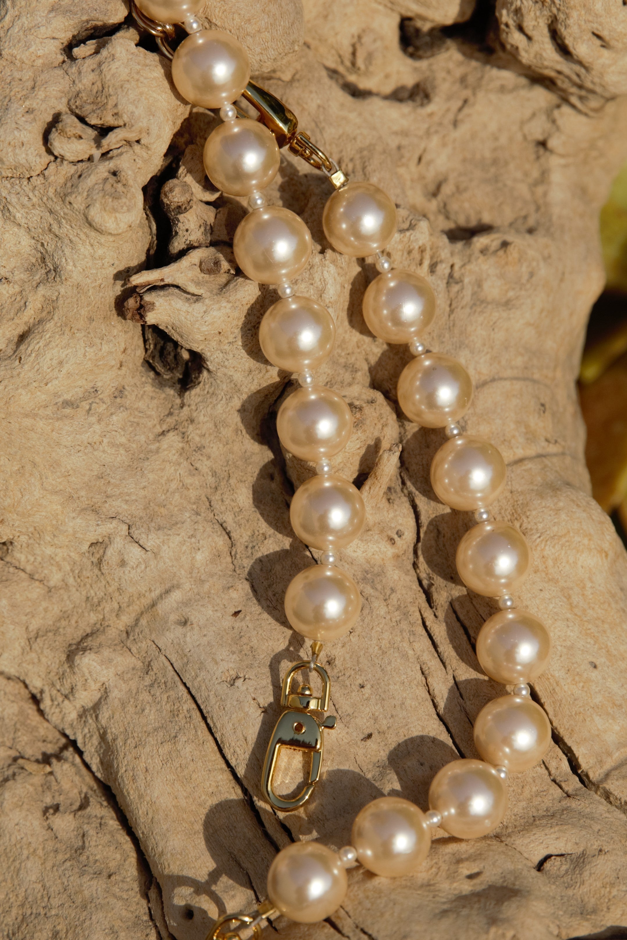 Champagne pearl strands with gold clasps