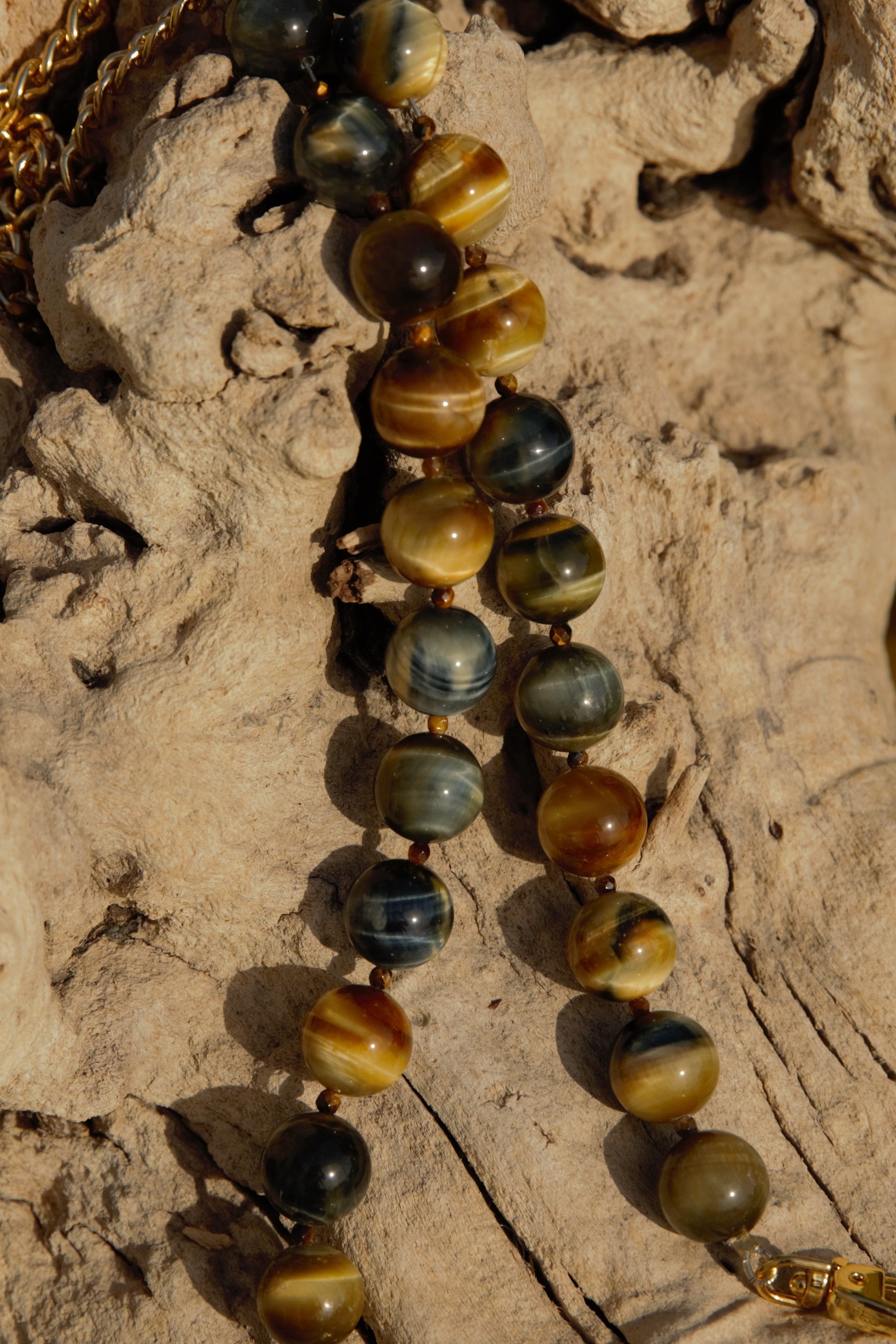 Fancy tiger's eye strands with gold clasps