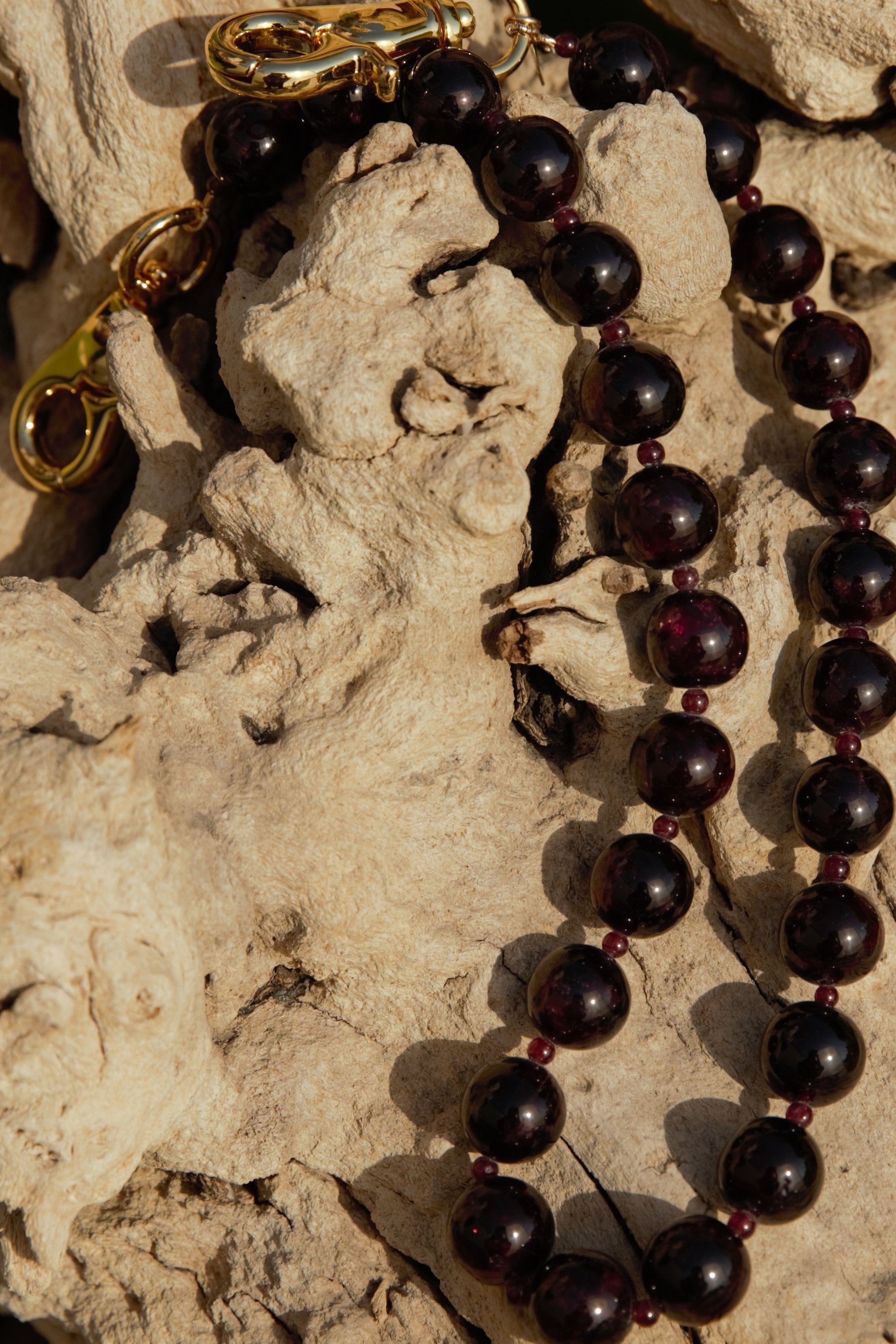 Garnet with gold clasps