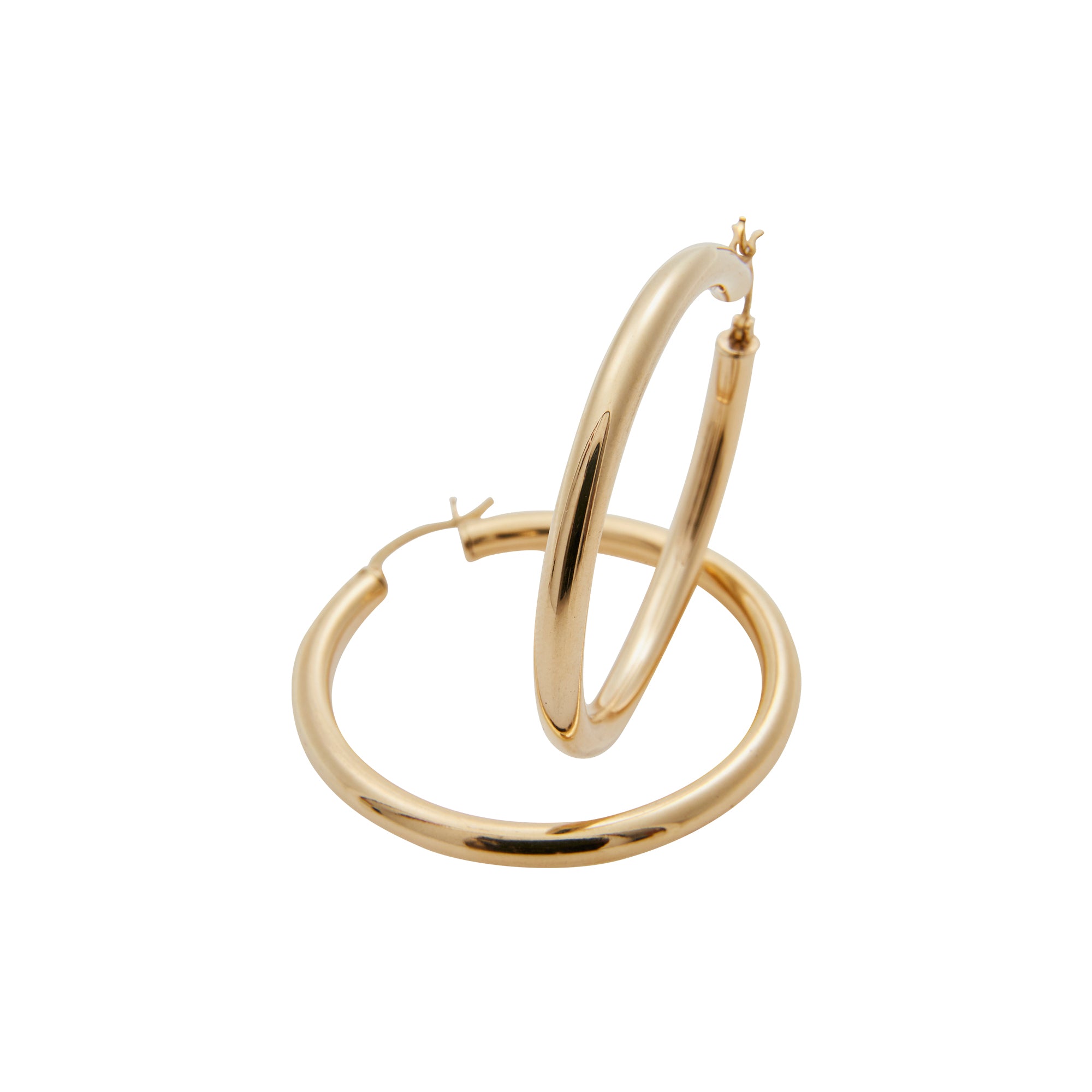 Large gold hoops from Jeuje Fine Jewelry on a white background