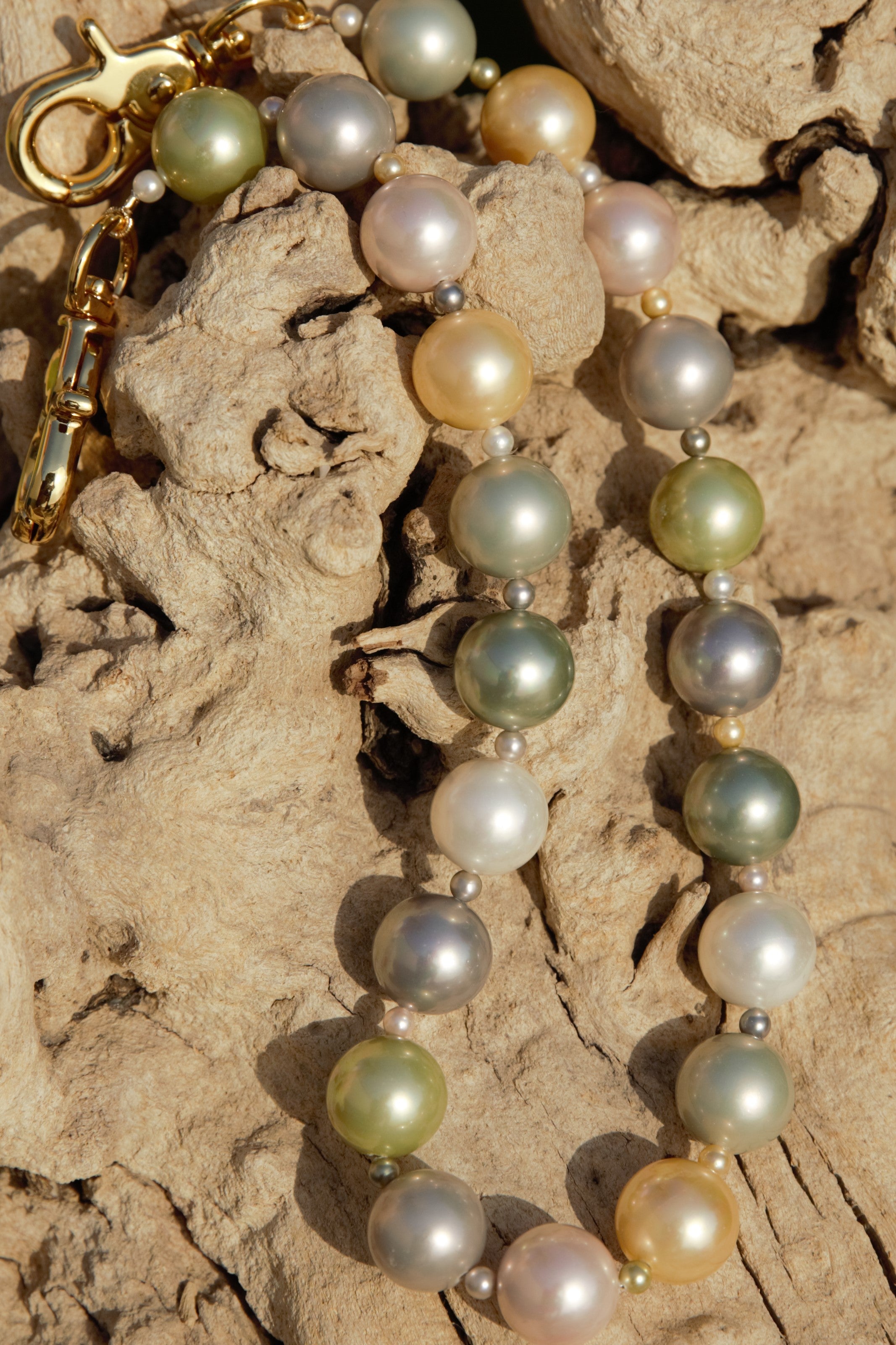 Multi-colored pearl with gold clasps