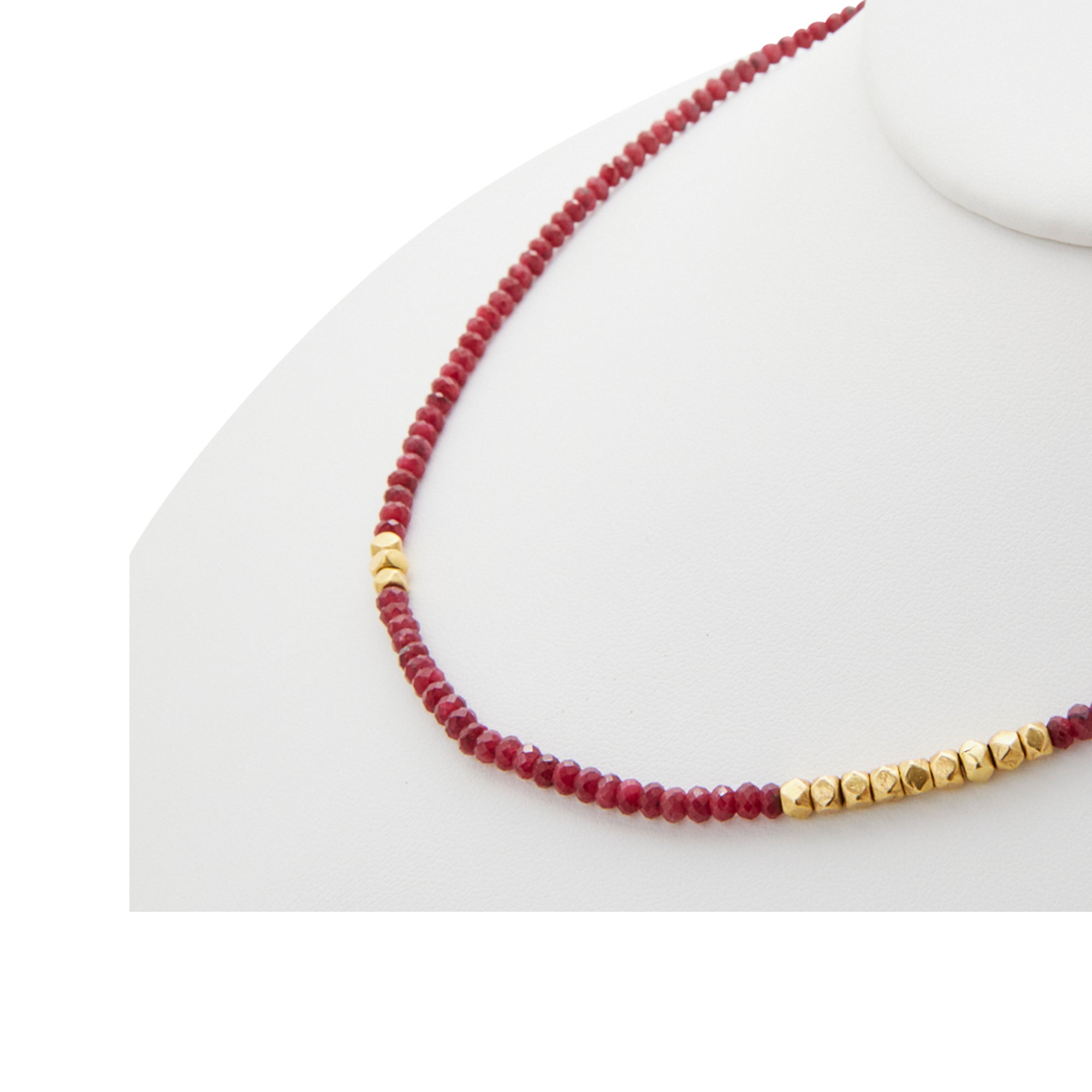 Raw ruby necklace from Jeuje Fine Jewelry on a white background