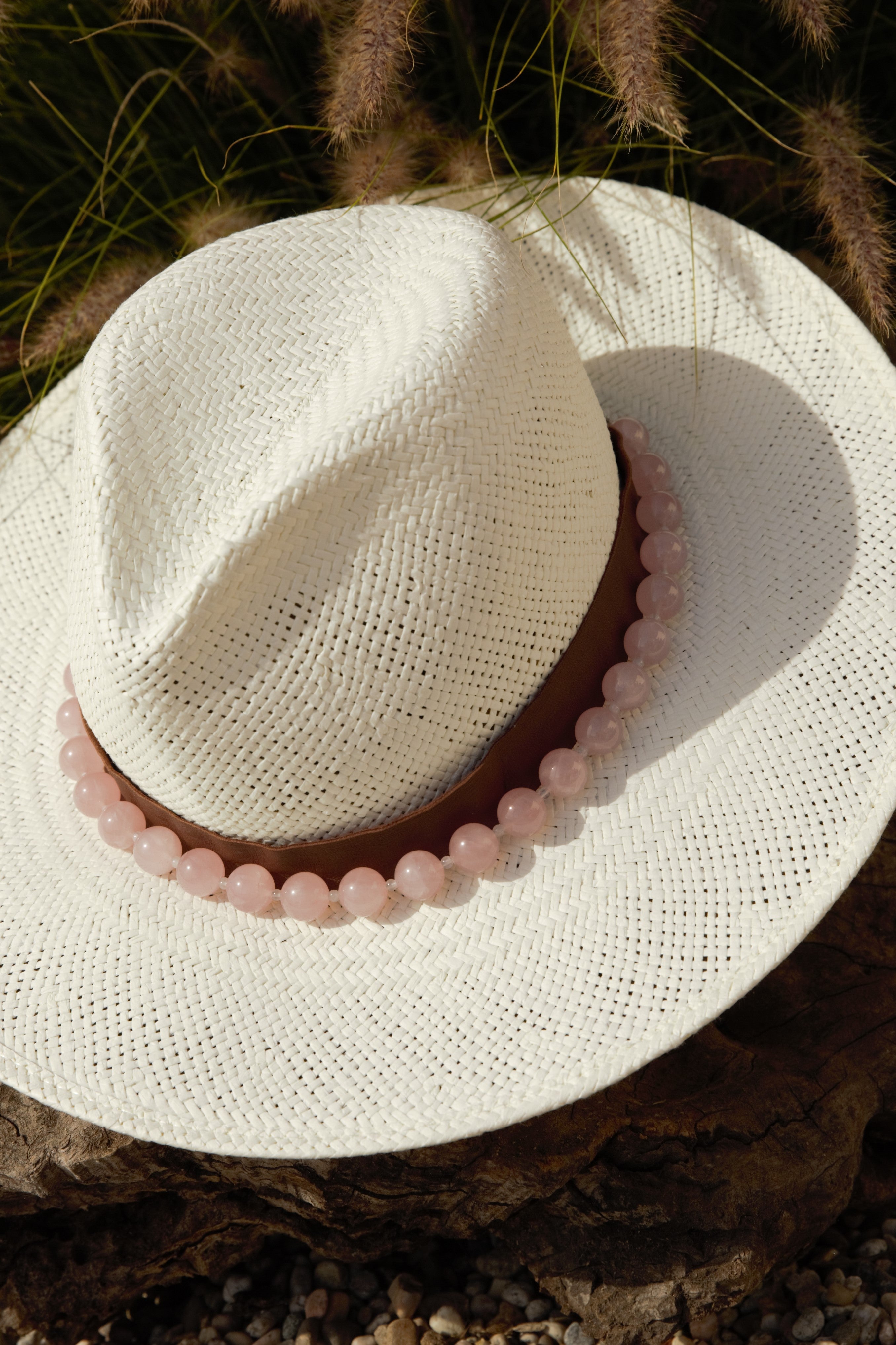 Straw hat featuring the rose quartz hat band