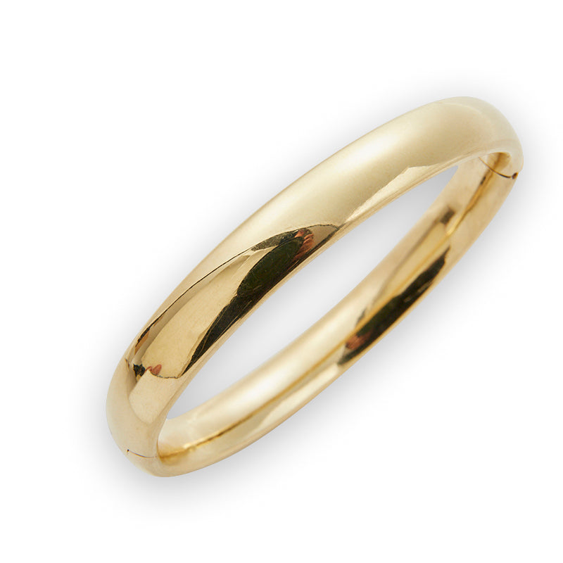 Smooth gold bangle from Jeuje Fine Jewelry on a white background