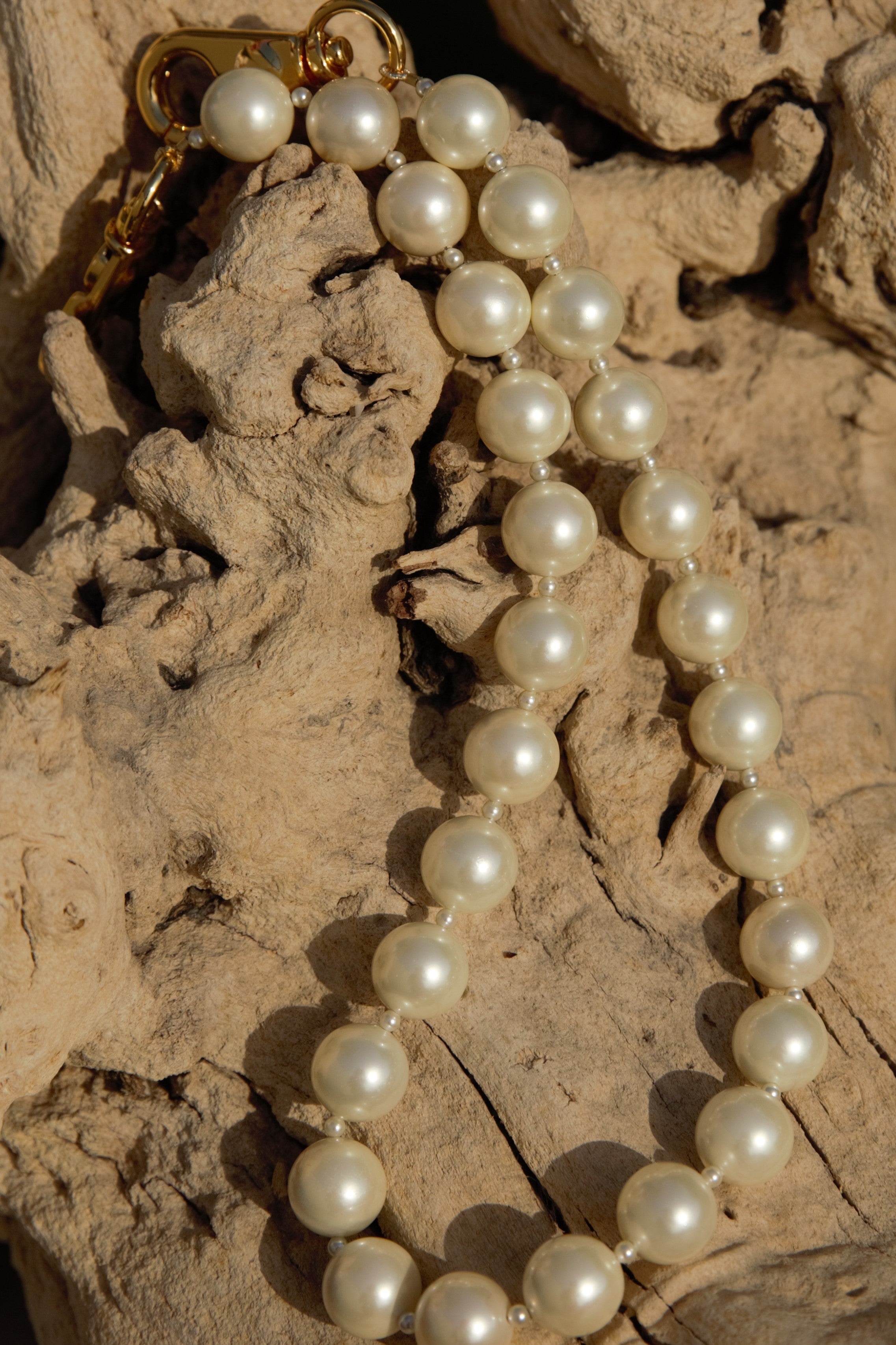 White pearl strand with gold clasps