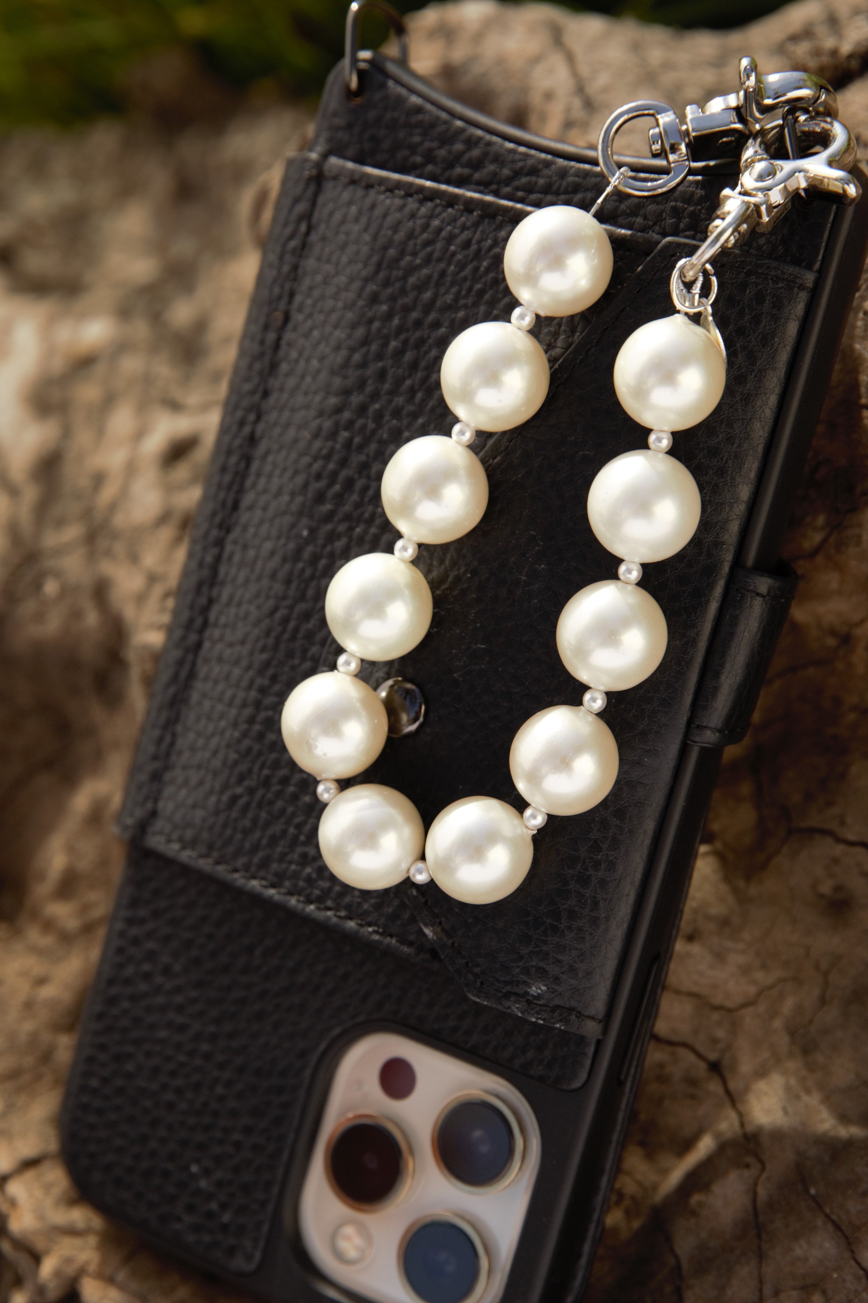 White pearl wristlet with silver clasps